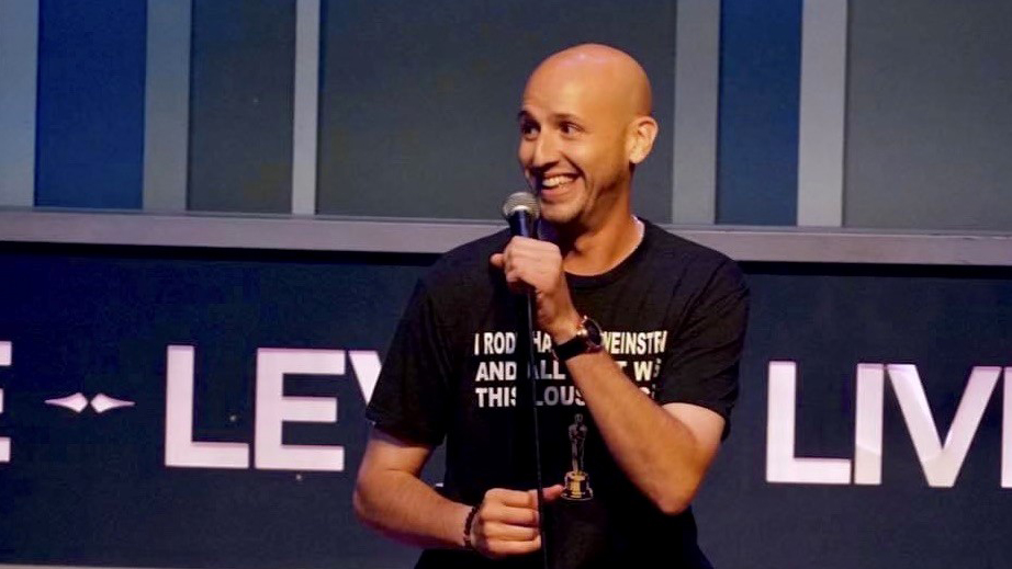 Dave at Levity Live performing impressions